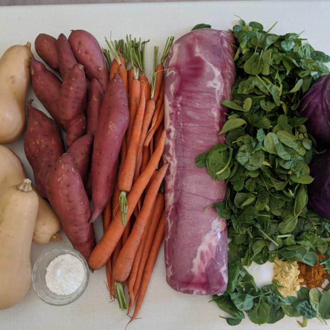 The Original Crockpet Diet bundle with Holistic Total Body Support Multivitamins on a kitchen countertop with fresh vegetables and supplements