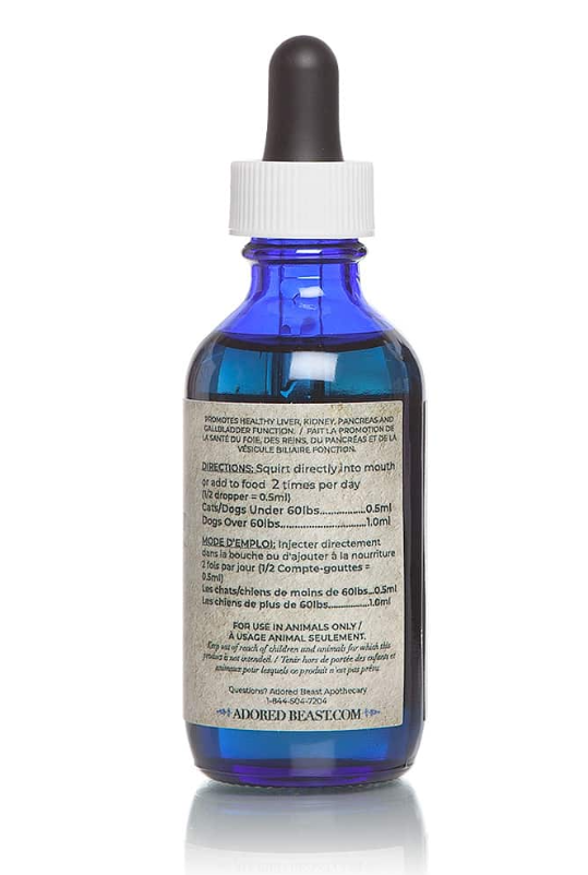 The back of a blue bottle of Adored Beast Apothecary Liver Tonic Support/Detoxifier with a white dropper cap. It promotes liver, kidney, pancreas, and gallbladder health. Directions: 0.5 ml for pets under 60 lbs, 1 ml for those over 60 lbs, twice daily. Text in English and French. For animals only. Includes website 'AdoredBeast.com' and a contact number.