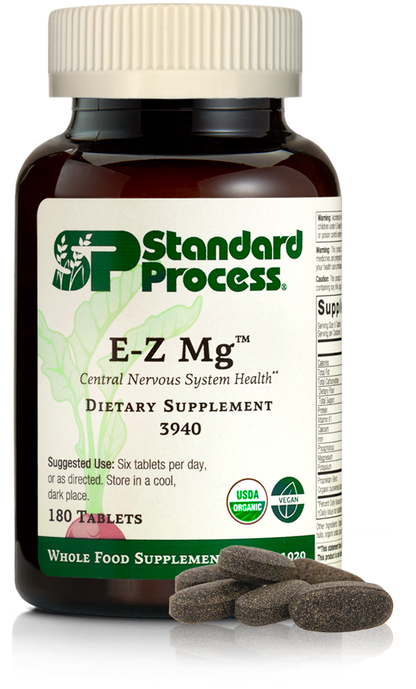 Image of E-Z Mg bottle next to tablets of magnesium supplements.