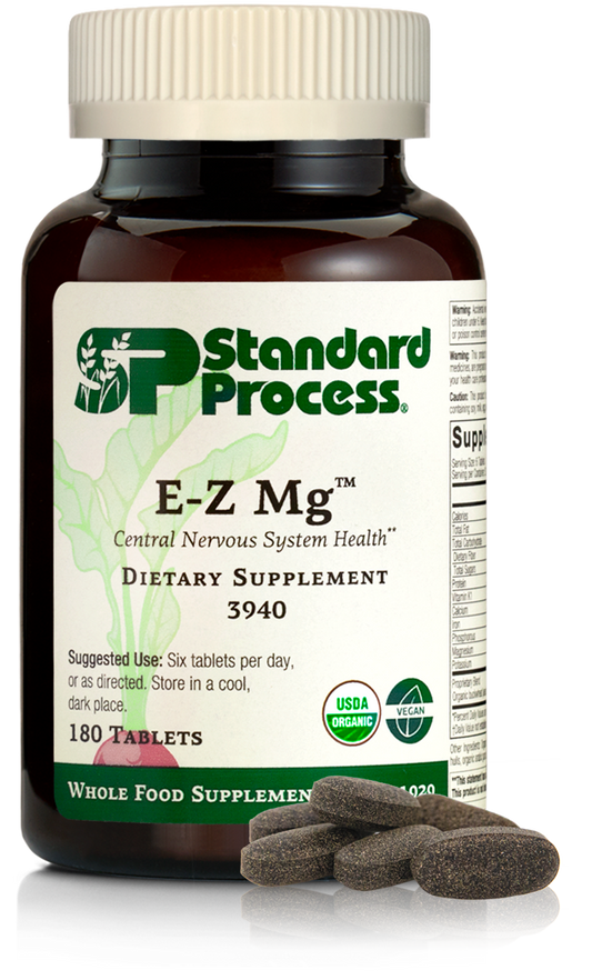 Image of E-Z Mg bottle next to tablets of magnesium supplements.