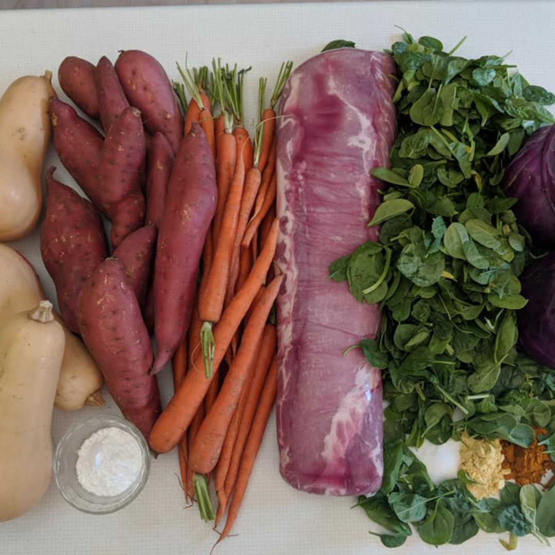 The Original Crockpet Diet bundle with Holistic Total Body Support Multivitamins on a kitchen countertop with fresh vegetables and supplements
