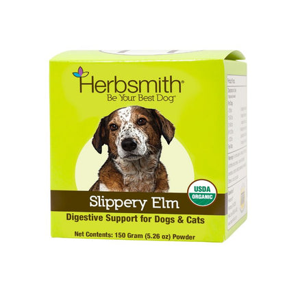 A green box of Herbsmith "Slippery Elm," labeled as "Digestive Support for Dogs & Cats," features a photo of a brown and white speckled dog. The Herbsmith logo and tagline "Be Your Best Dog" are at the top. The product name "Slippery Elm" is in white text on a brown strip, with "Digestive Support for Dogs & Cats" below in yellow. The box contains 150 grams (5.26 ounces) of powder and displays a USDA Organic seal on the bottom right.