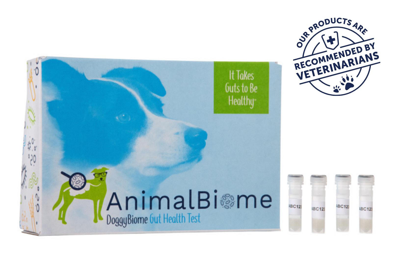 AnimalBiome DoggyBiome Gut Health Test packaging with a dog's face, slogan 'It Takes Guts to Be Healthy,' and vials labeled 'ABC123.' Seal reads 'Our Products Are Recommended by Veterinarians.'